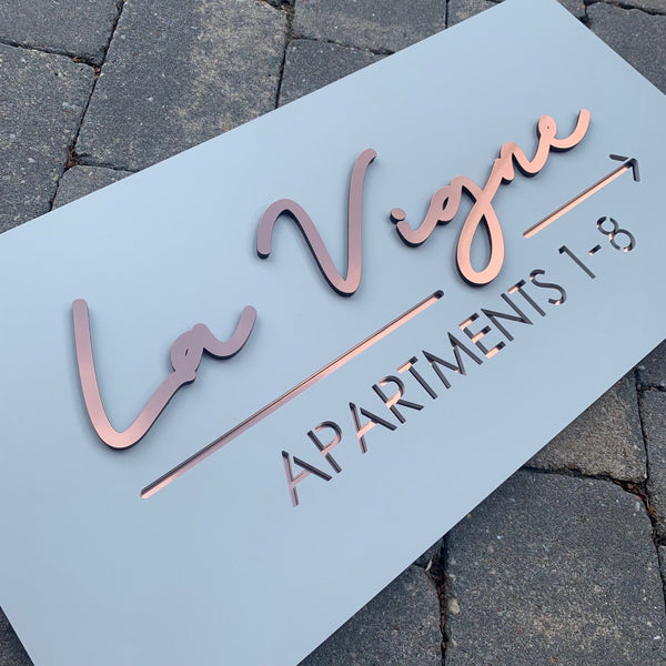 Customised grey and copper laser cut apartment sign